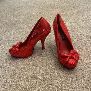 Red sequin pumps